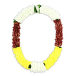 An open, horseshoe-shaped floral garland sits against a clean white background, its colours arranged in calm, deliberate bands that speak of care and ceremony. The top of the garland is purely white, made from myriad tiny blossoms that appear almost feathery, like small chrysanthemum or jasmine heads closely stitched together to form a soft, clouded arc. As the garland curves down, the mood deepens into sections of maroon on either side, the petals densely packed to create a velvety, substantial texture, giving the piece a sense of gravity and respectful formality. Along the lower sweep, the flowers turn to a clear, warm yellow, bright but not overpowering, offering a quiet suggestion of comfort and remembrance. Between these colour fields, discreet touches of fresh green leaves peek out, especially where the white meets the maroon and where the yellow is framed, adding a natural, garden-fresh note. The overall effect is of a luxurious, mala-like garland, possibly crafted as a funeral tribute or temple offering, its symmetry and fullness reflecting the steady hands of a skilled florist familiar with cultural rites. With no visible support, the garland appears to float, making the floral work the sole focus of the image. It is easy to imagine this piece being delivered to a family home or local place of worship around Cheam, laid gently as a gesture of honour, blessing, and farewell during a time of reflection and shared memory.