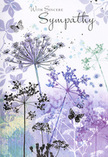 This sympathy card reads like a quiet visual poem, inspired by the kind of peaceful meadow scene you might imagine just beyond Nonsuch Park's pathways on a still evening. Airy silhouettes of wildflowers stretch skyward, their slender stems lightly drawn and their umbel-shaped heads painted in graceful shades of lavender, indigo, and soft blue. The blossoms appear to float, each tiny floret picked out with delicate detail, catching an imagined, gentle light that glows against a background of muted purples and cool, smoky blues. Subtle flecks and shadows hint at foliage drifting behind the main stems, giving the image a dreamlike, layered quality. Here and there, butterflies hover near the blooms, semi-transparent and softly edged, evoking transformation and the sense that loved ones remain close even when we can no longer see them. The colours are cool but comforting, like the hush that falls over Cheam's gardens at dusk, calming the mind and easing the heart. Across the upper portion of the design, the words With Sincere Sympathy are written in elegant, flowing script, their placement carefully balanced so they feel woven into the scene rather than placed on top of it. The message and the imagery together create a feeling of gentle presence and respect-nothing showy, just a quiet acknowledgement of deep loss. It's exactly the kind of thoughtful, understated card someone might choose from a local Cheam florist when they want their condolence to feel personal, natural, and wrapped in the soft reassurance of nature.